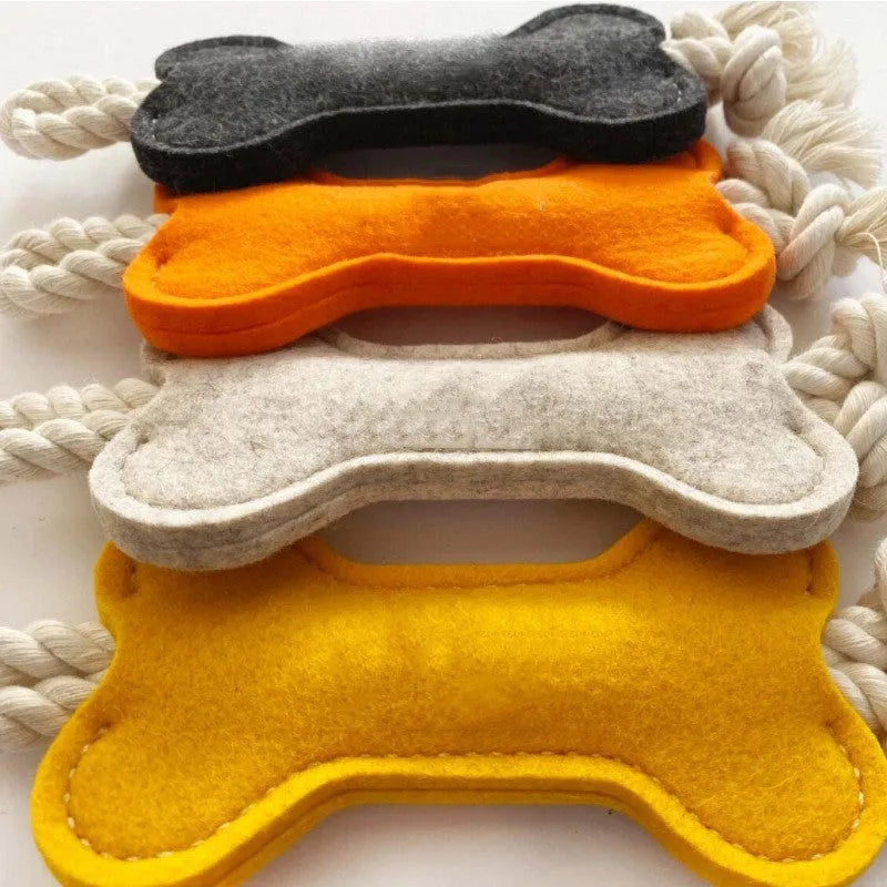 Bone-shaped dog toy with rope knots in felt construction, measuring 16cm by 7cm