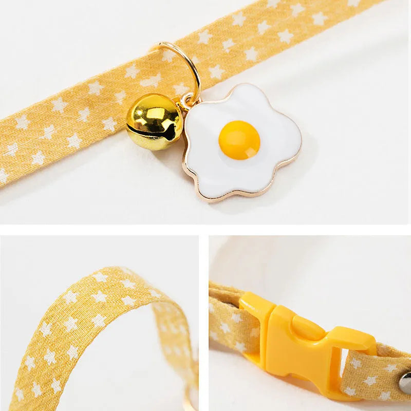 Adjustable cat collar with bell pendant and bow tie on small dog showing 17-33cm sizing range