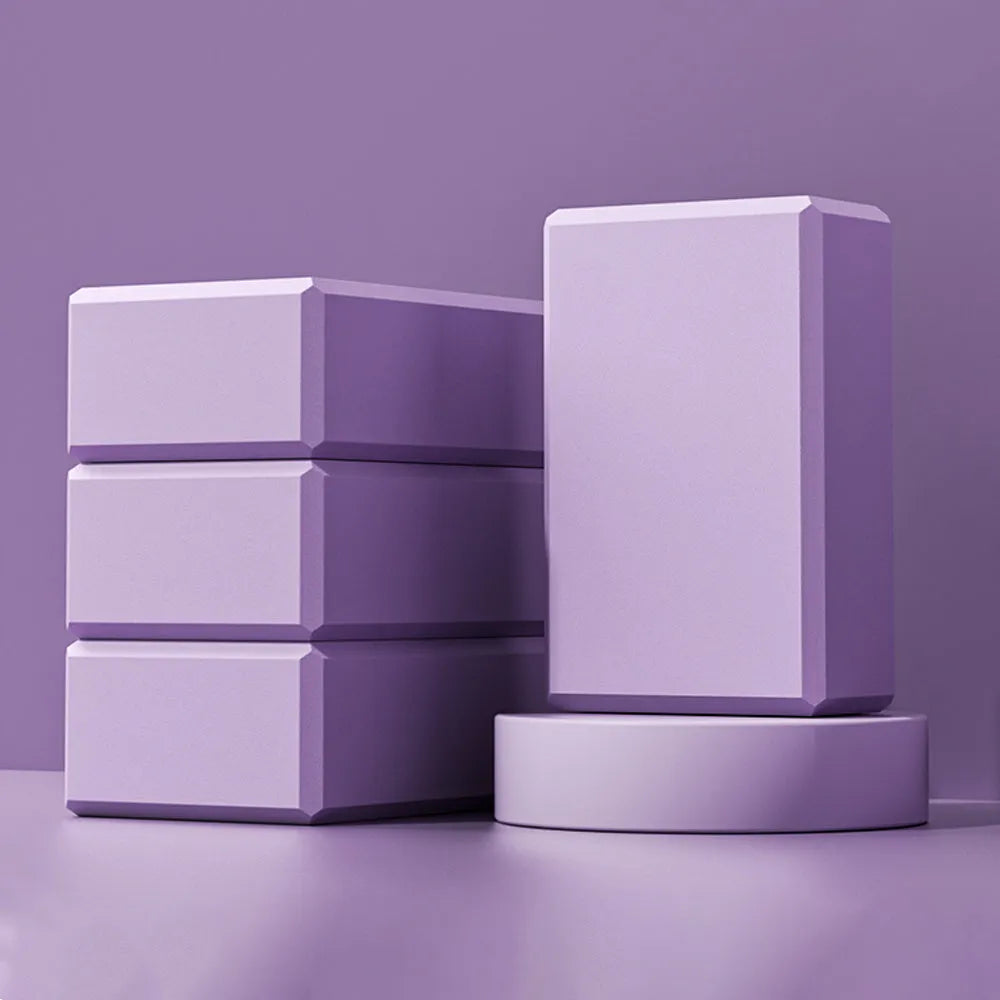 Blue EVA foam yoga block showing hexagonal facets and ridge pattern for improved grip