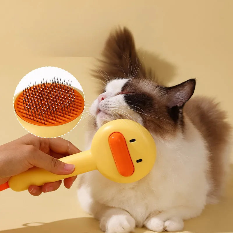Small yellow duck-shaped comb for pet grooming with open section and needle bristles