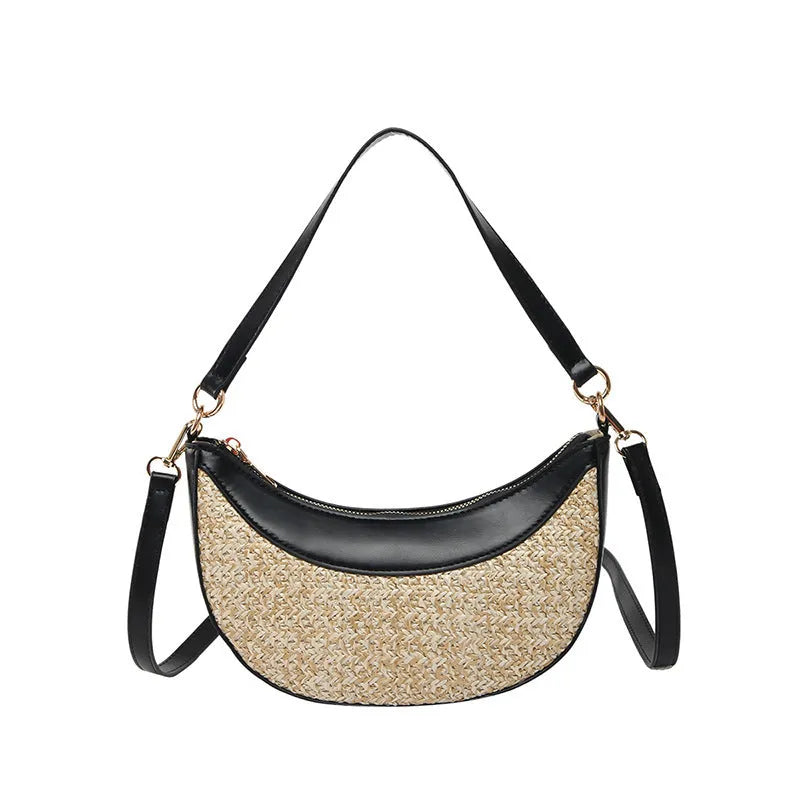 Hard straw women's crossbody dumpling bag in black with contrast stitching and internal organisation pockets.