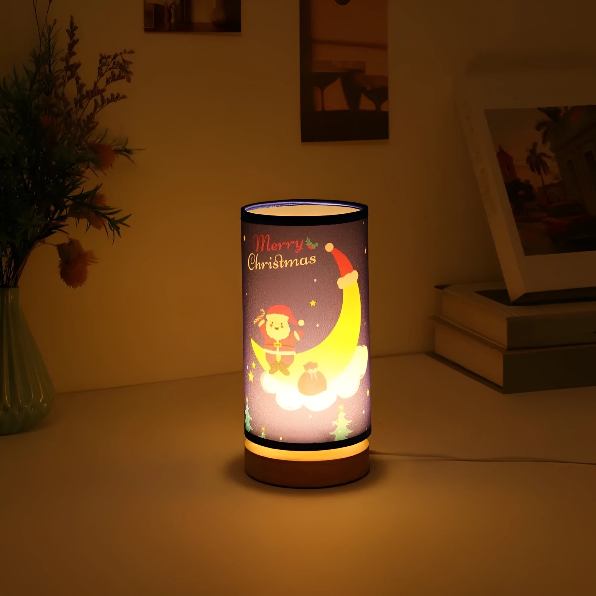 Moon-shaped Santa Claus LED night light with USB plug and bamboo base.