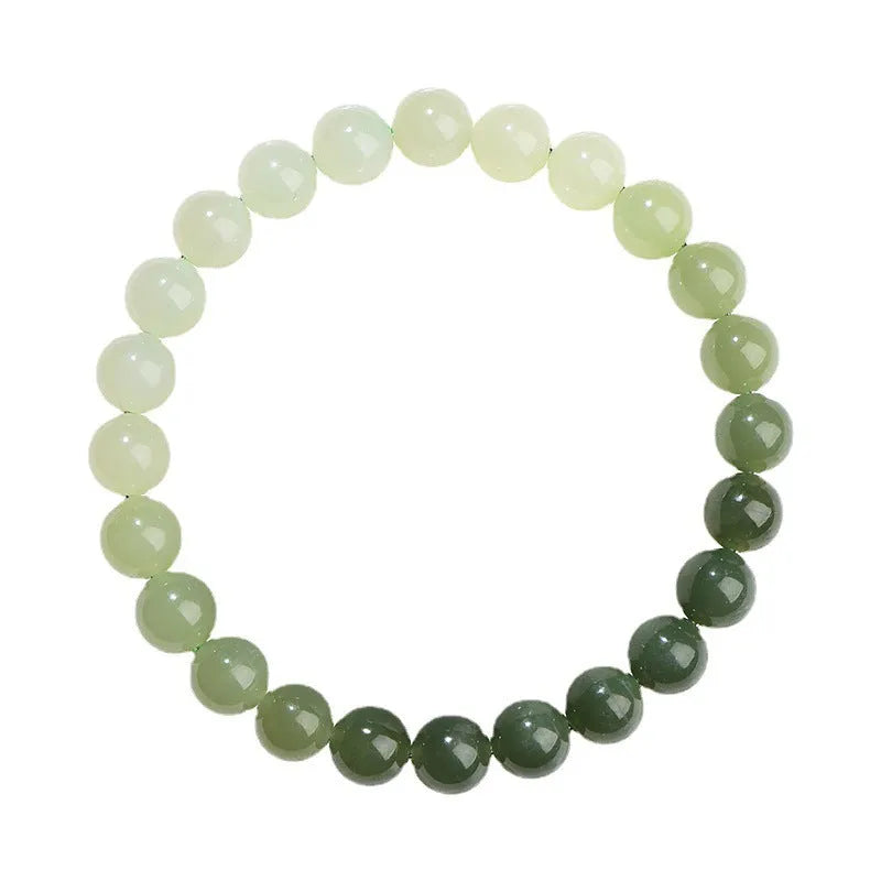 Natural gradient water Hetian jade bracelet with choice of round or barrel beads.