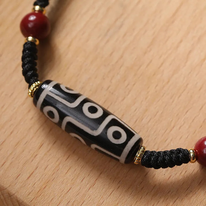 Tibetan agate dzi bead bracelet with stainless steel adjustable clasp showing 30 models of beads