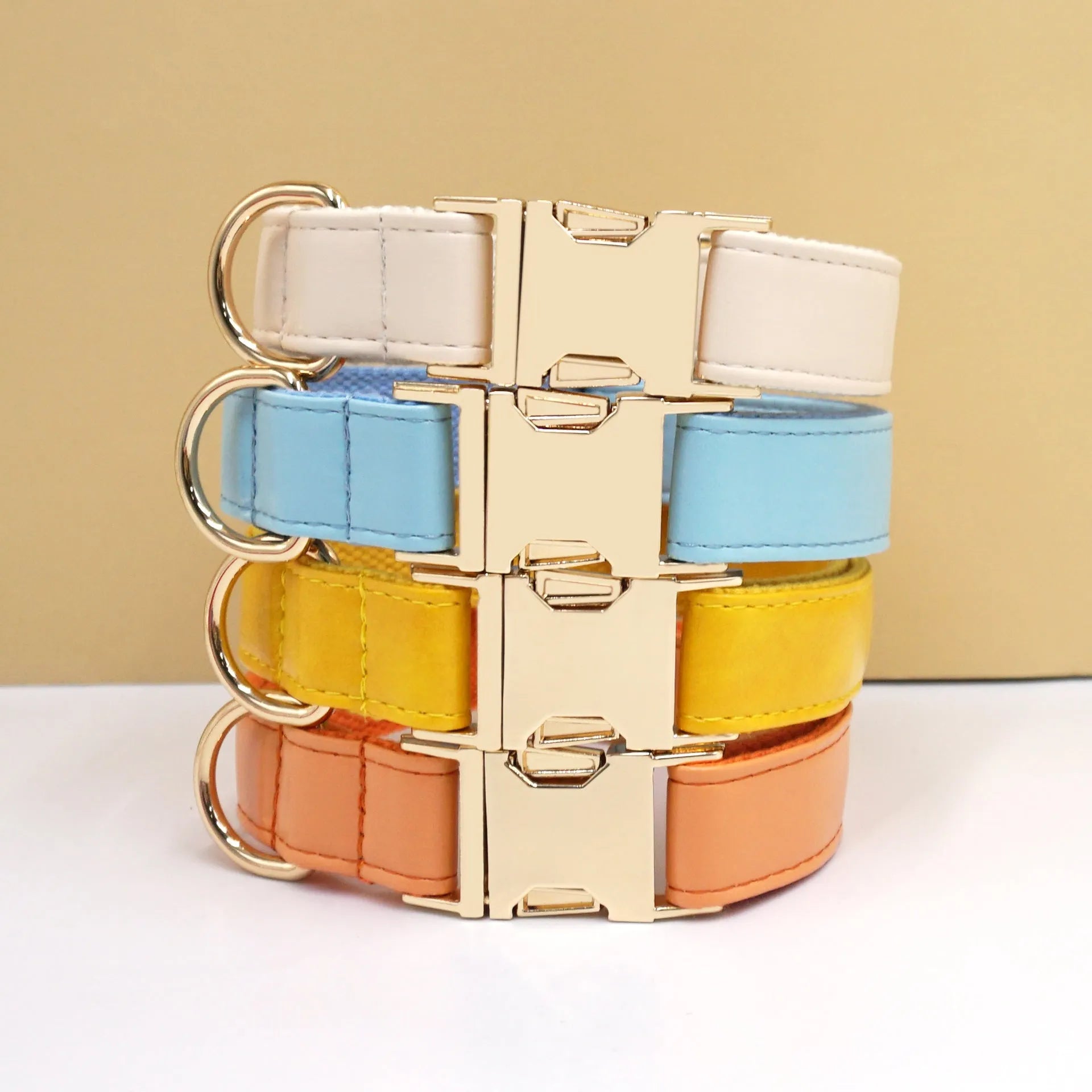 Leather dog collar with velvet texture section in colour block design, shown on a buckle.