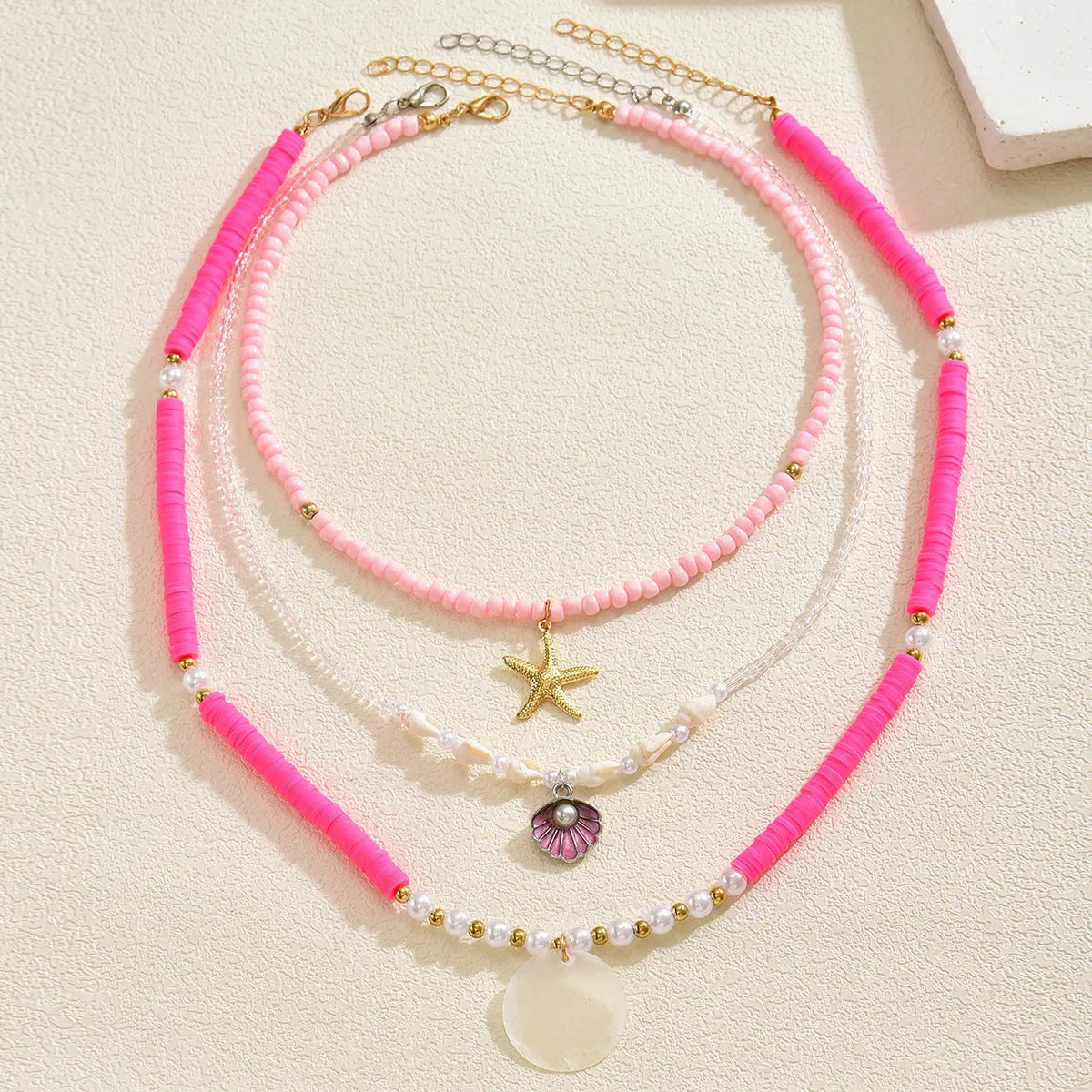 Polymer clay beaded necklace for women with multi-layer shell, twin clavicle chain, and geometric alloy pendant, 41-50cm.
