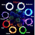 Bendable copper wire LED string lights wrapped around a wine bottle with 20 warm white LEDs glowing