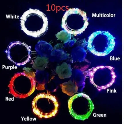 Bendable copper wire LED string lights wrapped around a wine bottle with 20 warm white LEDs glowing