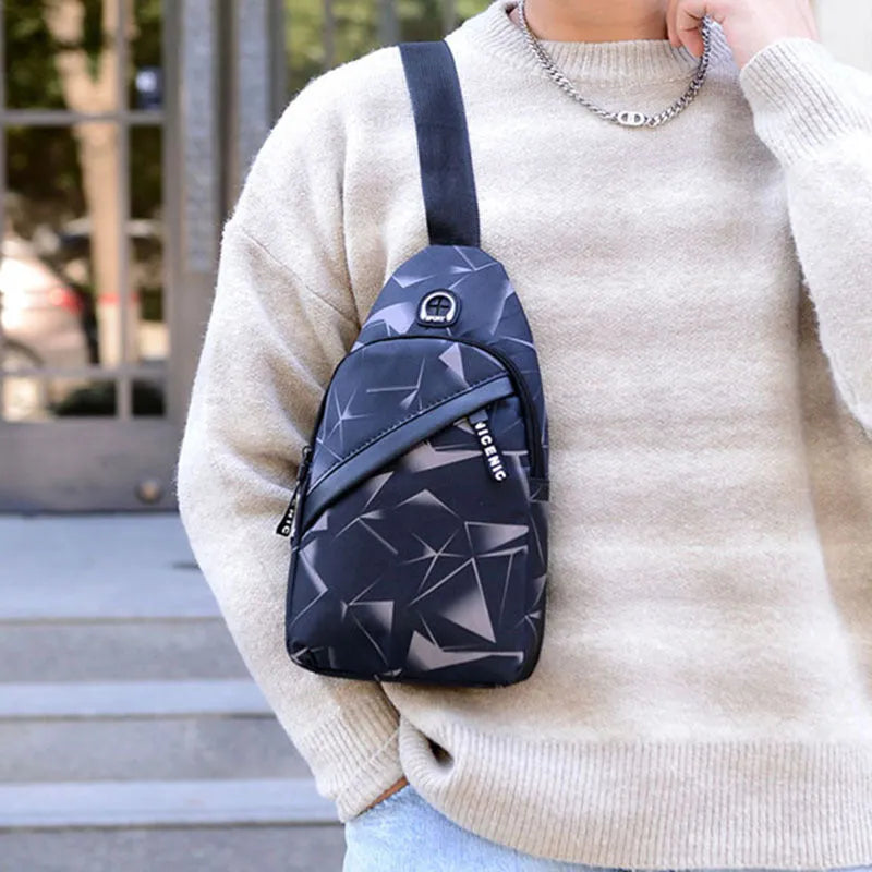 Men's crossbody chest sling bag in blue with earphone hole, zipper pockets, and soft handle, measuring 17x30x5cm