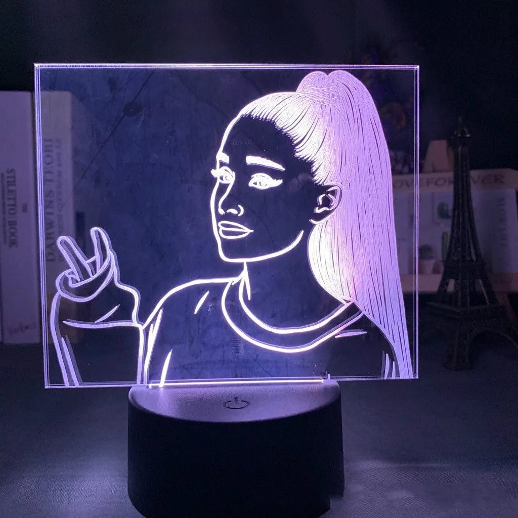 Slim acrylic 3D night light with LED illumination on a table.