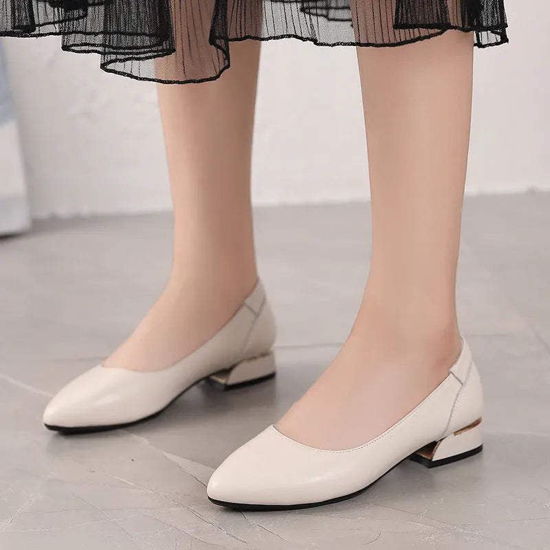 Beige pointed-toe casual shoes with a buckle fastening and flat rubber sole.