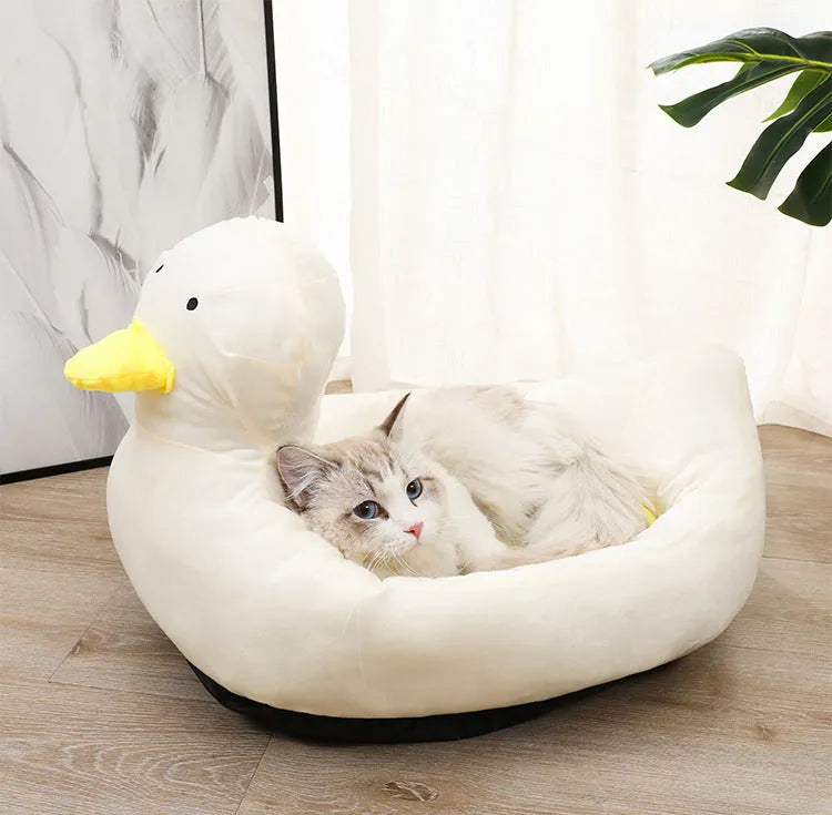 Duck-shaped pet bed sofa with fluffy polyester material in blue or white colour, showing raised sides and unique pattern design
