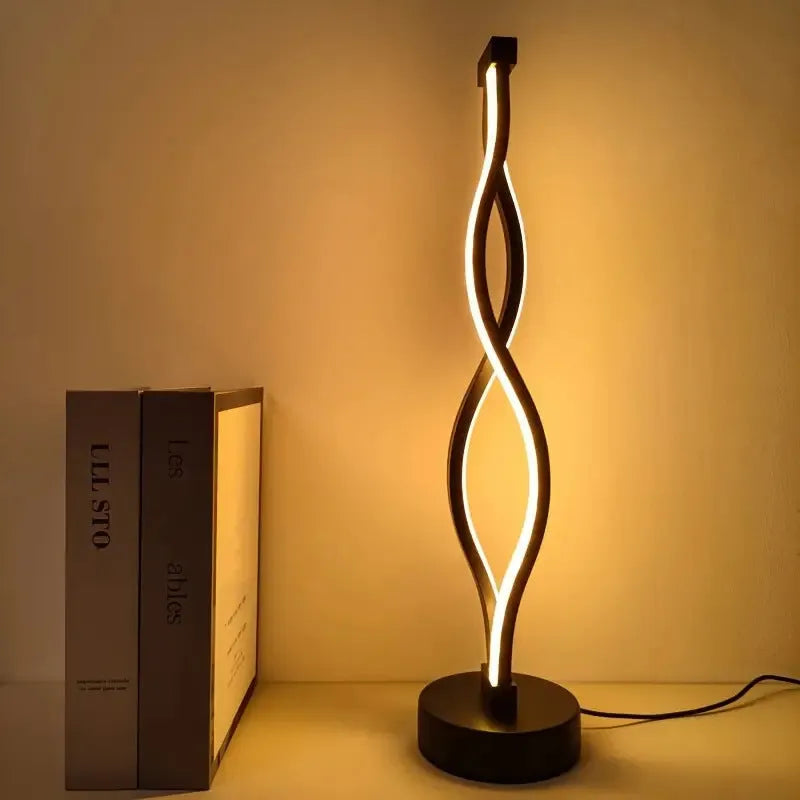 Black aluminium desk lamp with three-colour dimming button on desktop
