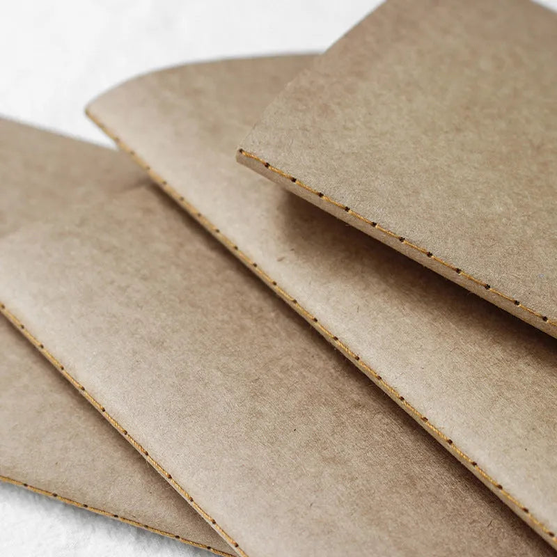 Cowhide diary refill inner core showing 11x21cm size and saddle stitch binding