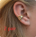 Gold-toned starfish and scallop eardrop earrings with conch designs and animal modelling on alloy construction