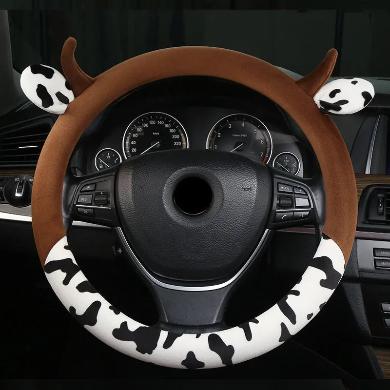 Black short plush steering wheel cover with protective handle grip on car steering wheel
