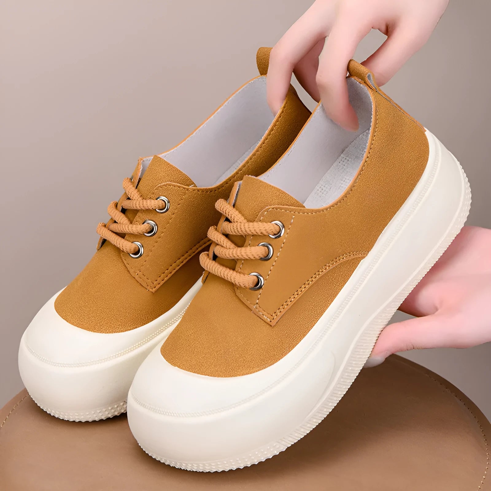 Women's camel suede platform loafers with round toe and front lace-up, showing 4cm sole lift