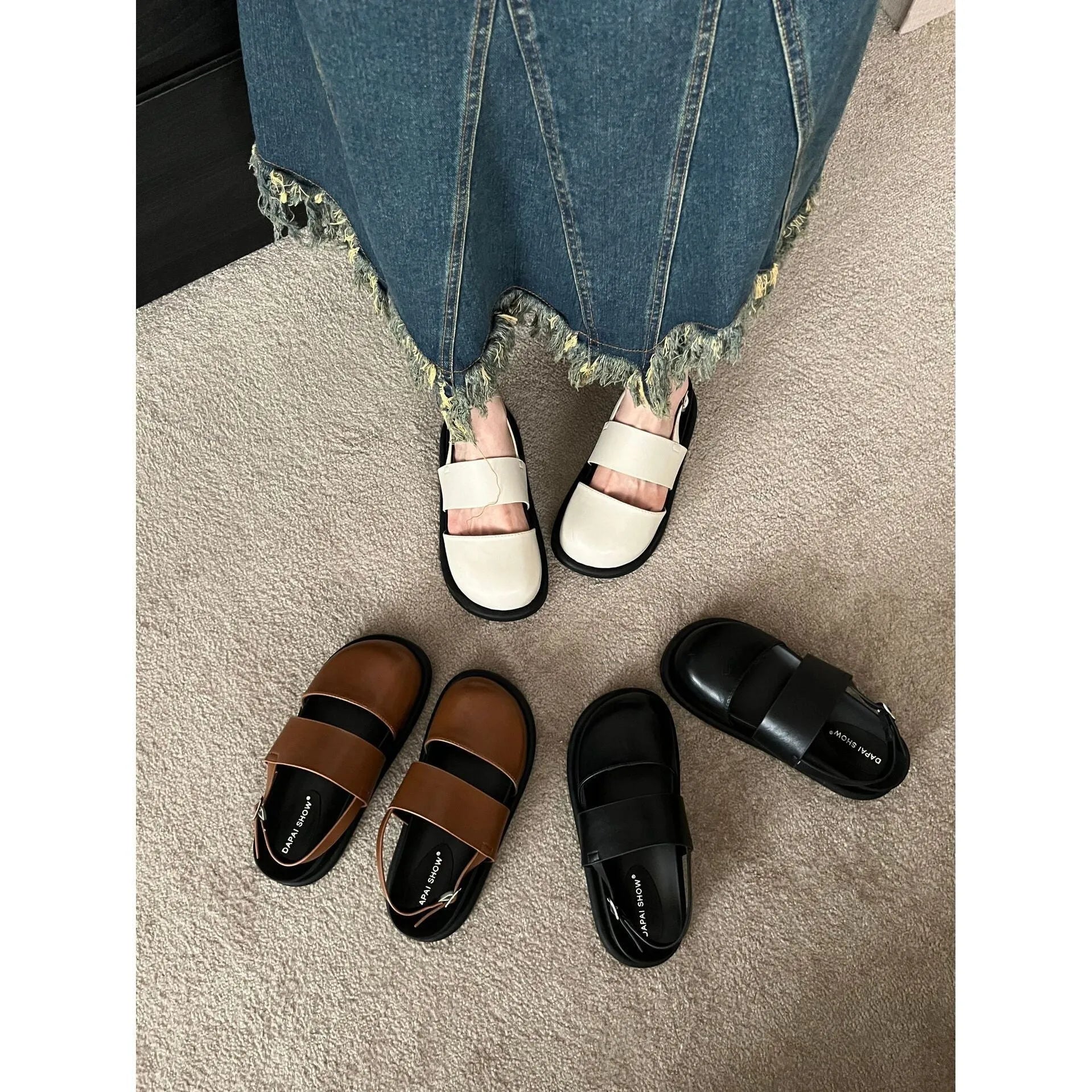Retro raised sole sandals with ankle-strap buckle in black microfiber