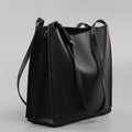 Genuine leather women's commuter bag in brown bucket design with organised internal compartments