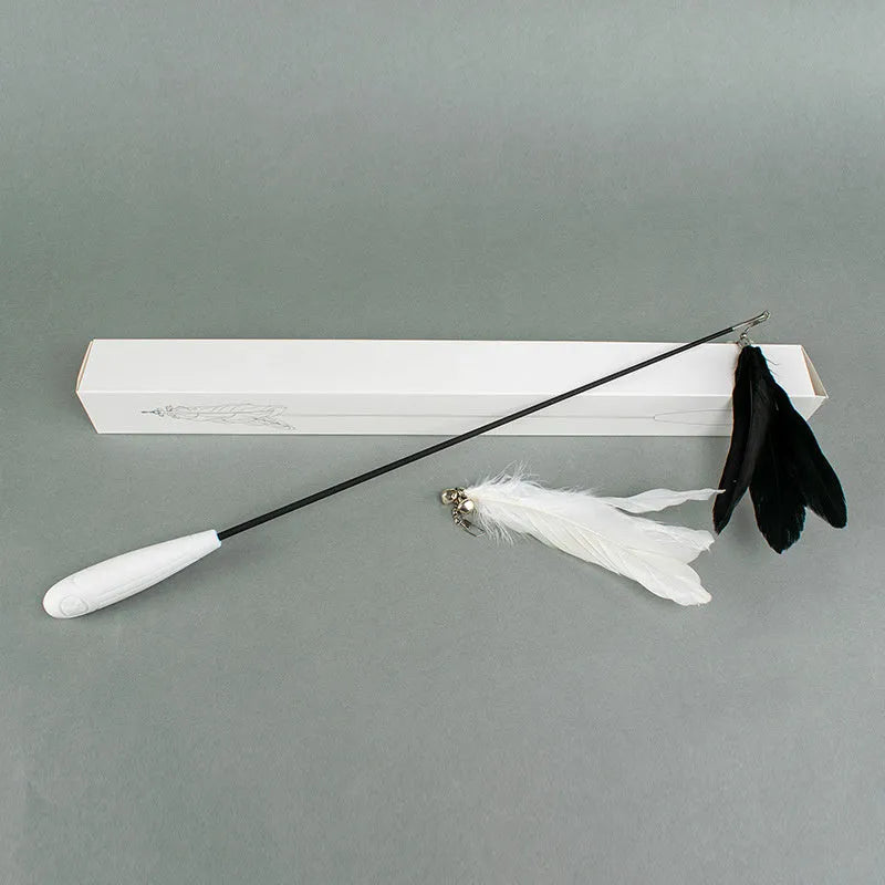 Telescopic cat fishing rod extended, showing goose feather bell toy and removable pen on fibre shaft
