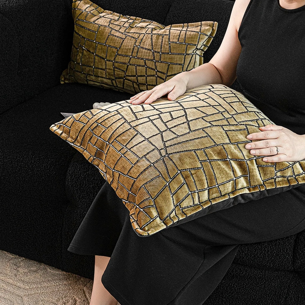 Tuhao gold geometric abstract pillow in 50x50cm size with feather velvet texture on a sofa