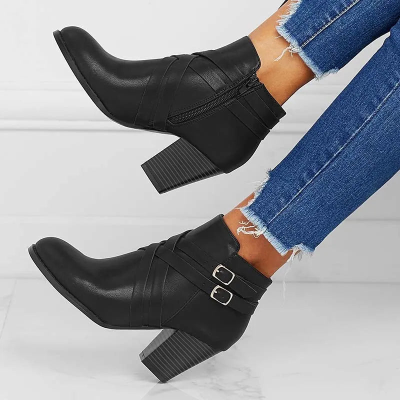 Short boots with 7cm heels in black, brown, or grey colours, showing side zipper and rubber sole