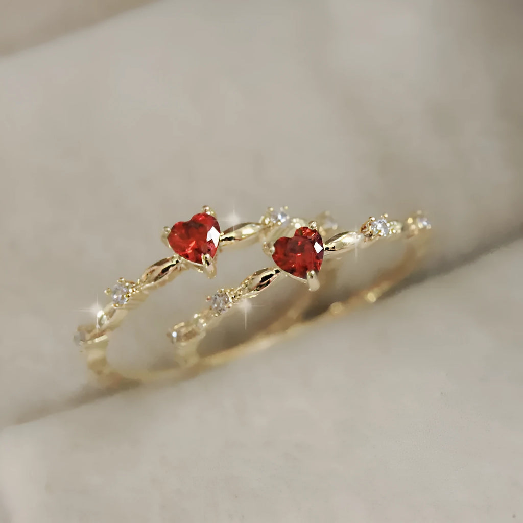 Gold and silver electroplated peach heart ring with zircon stones on a copper base.