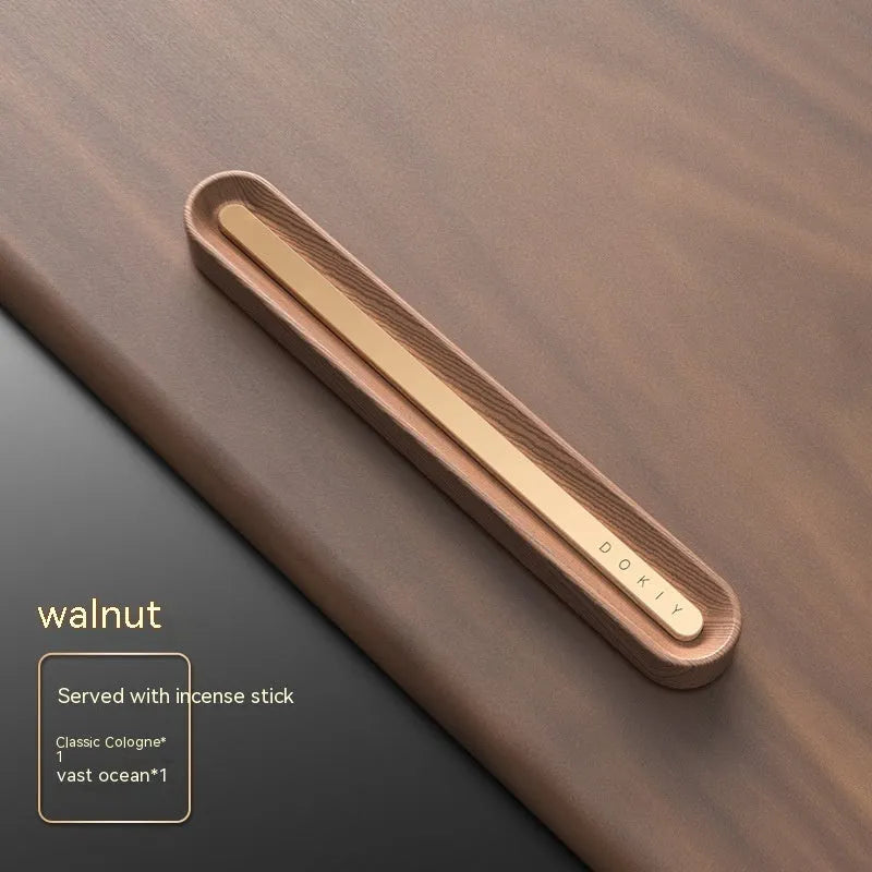 Long strip car aromatherapy ornament in walnut colour mounted on a car air vent