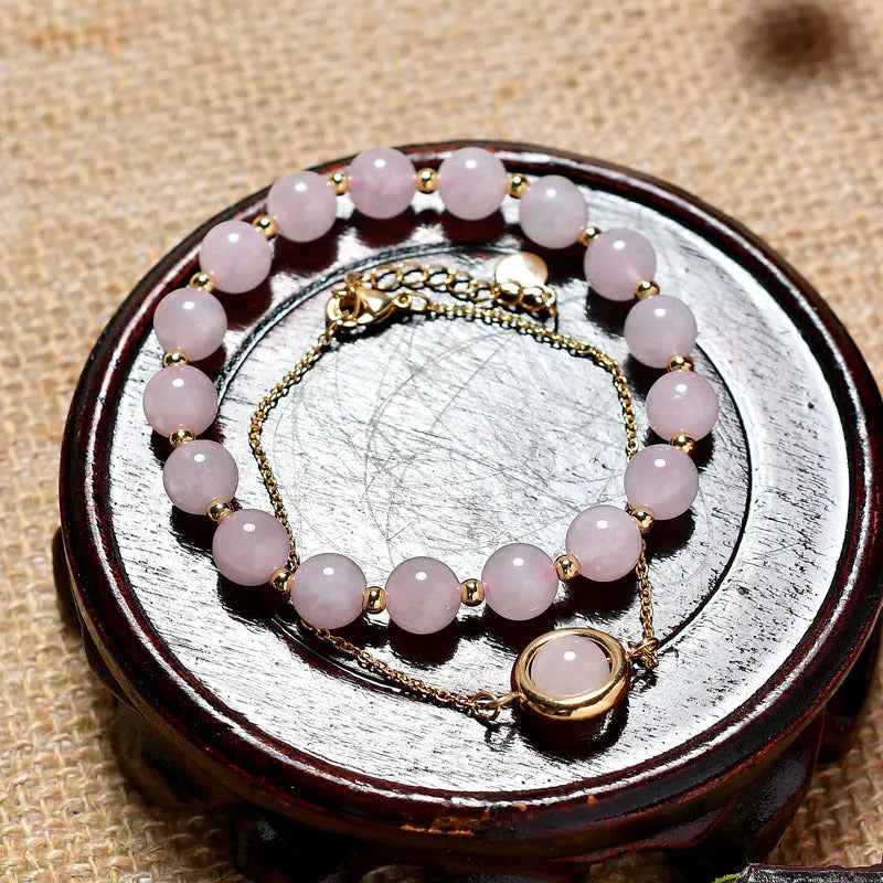 Women's double-layer copper bracelet with gold plating, strawberry quartz crystals, and lucky beads.
