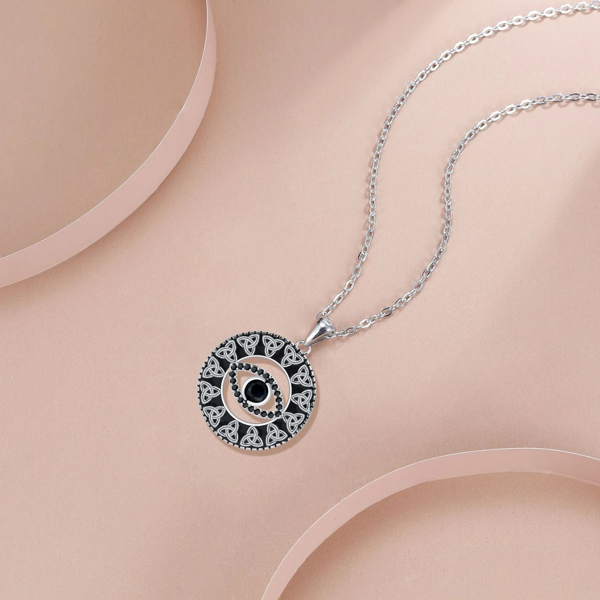 Copper devil's eye pendant necklace on a cross chain for women.