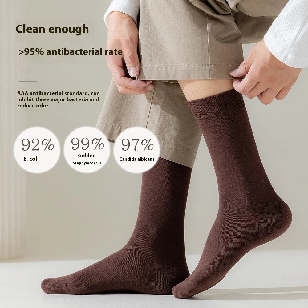 Mid-calf business men's socks in pure combed cotton with sweat absorption and deodorant properties, solid colour design