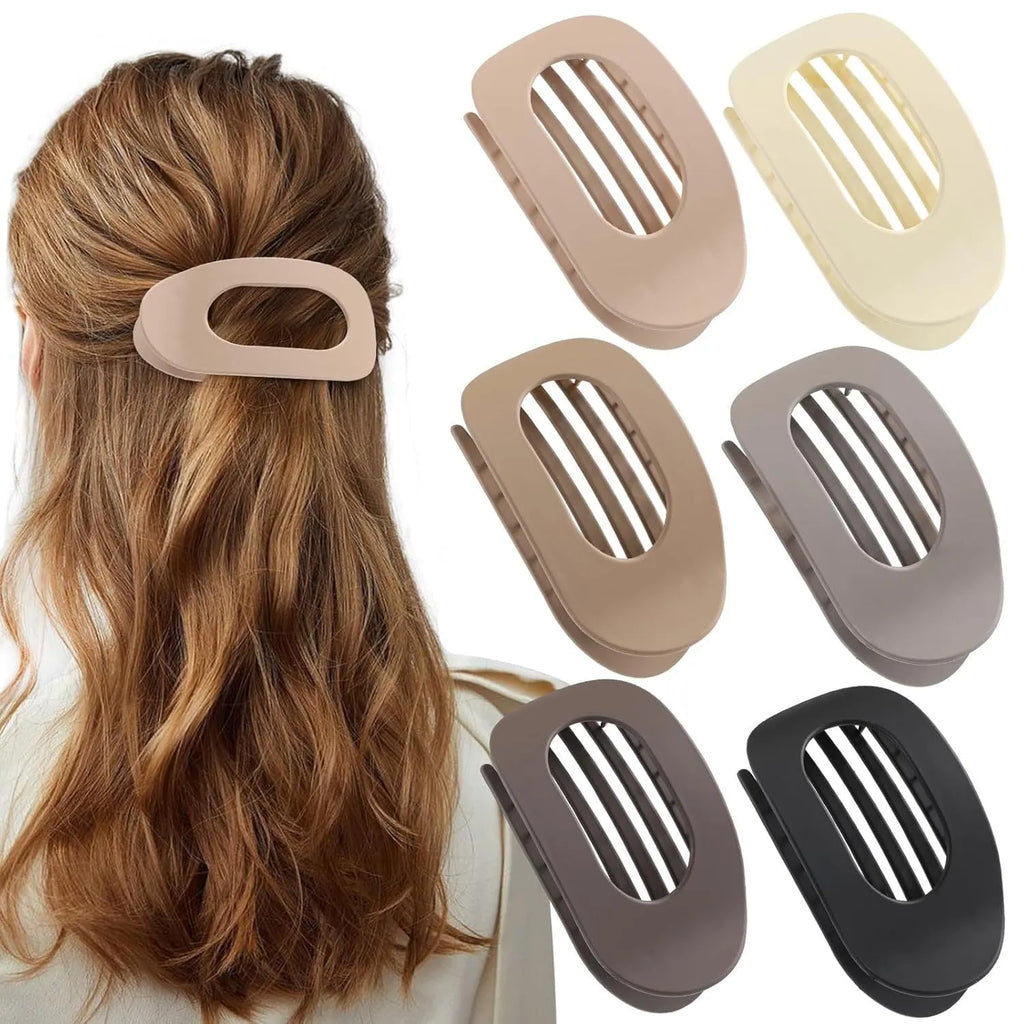 Six rose red plastic hair clips with frosted surface and quadrilateral shape arranged on white background