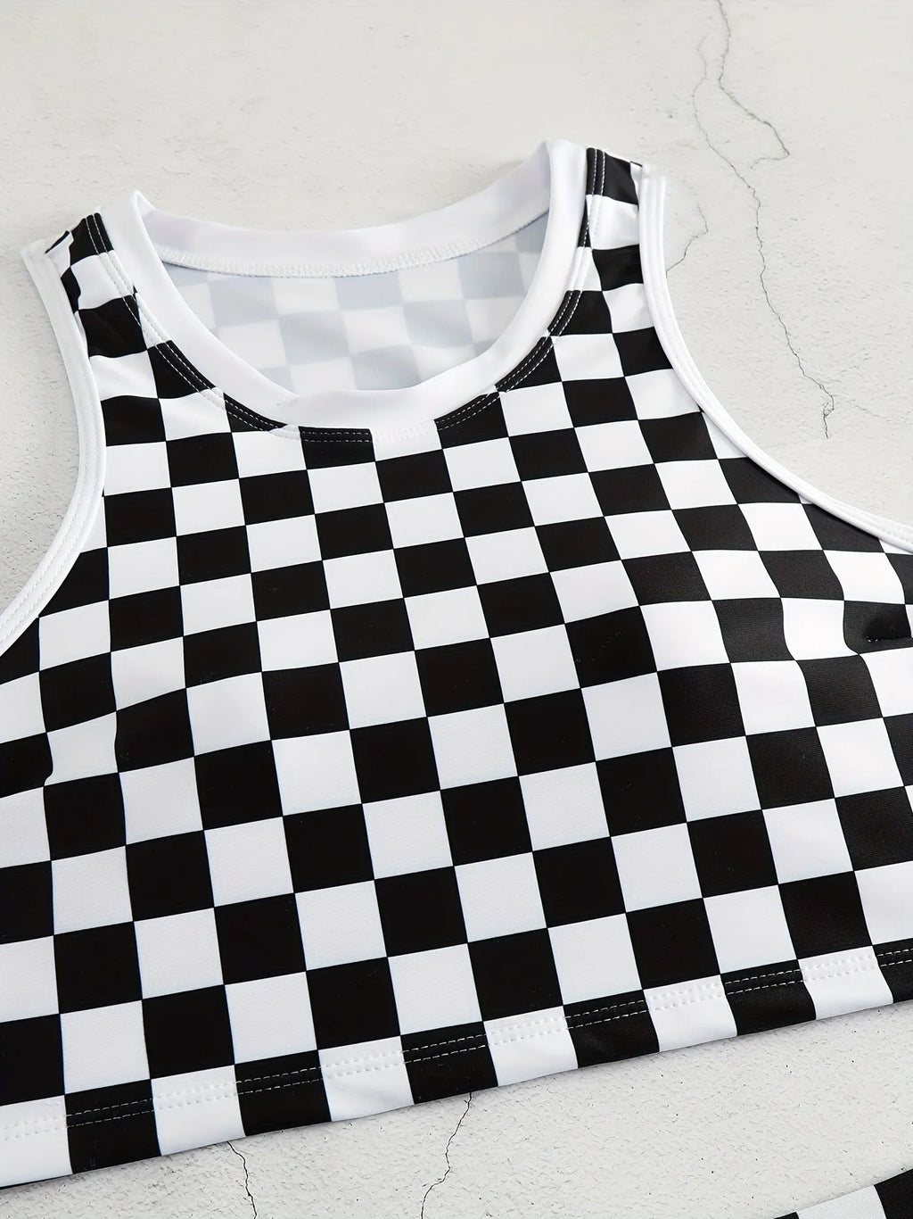 Women's check pattern racing swimsuit with backless suspender design in polyester fabric