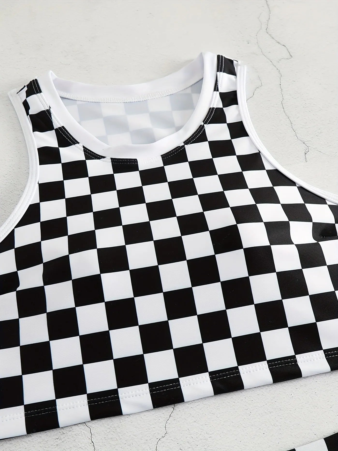 Women's check pattern racing swimsuit with backless suspender design in polyester fabric