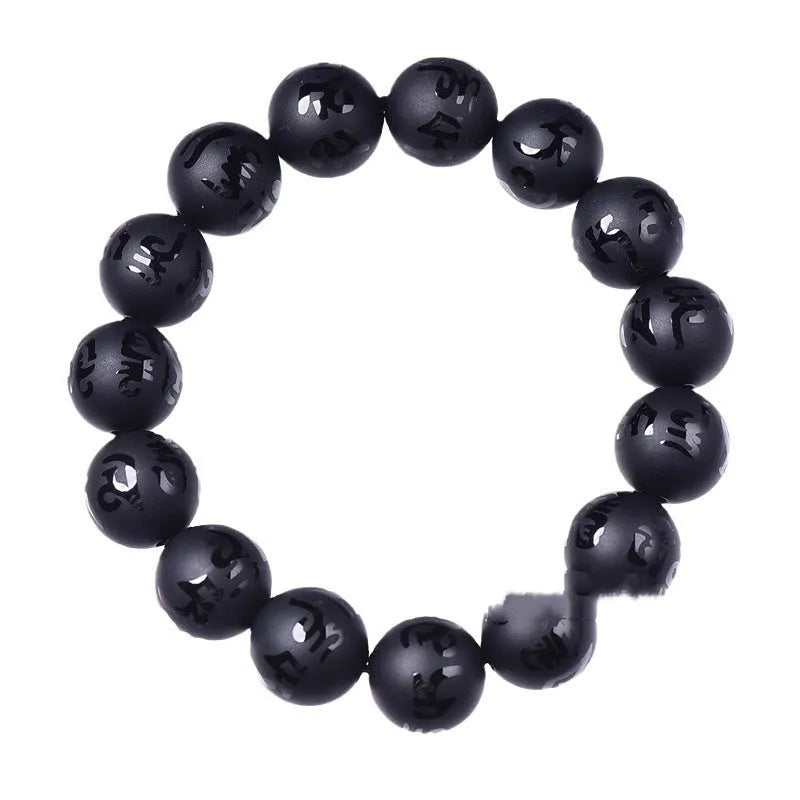 Natural frosted black agate bracelet with Sanskrit mantra and auspicious patterns, showing matte black stone glaze.