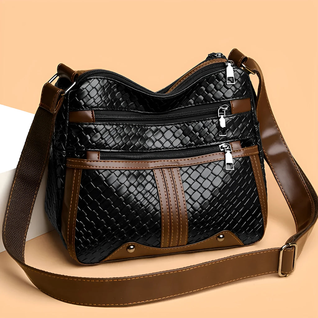 Woven PU messenger bag with horizontal square shape showing multiple compartments and internal zipper change pocket