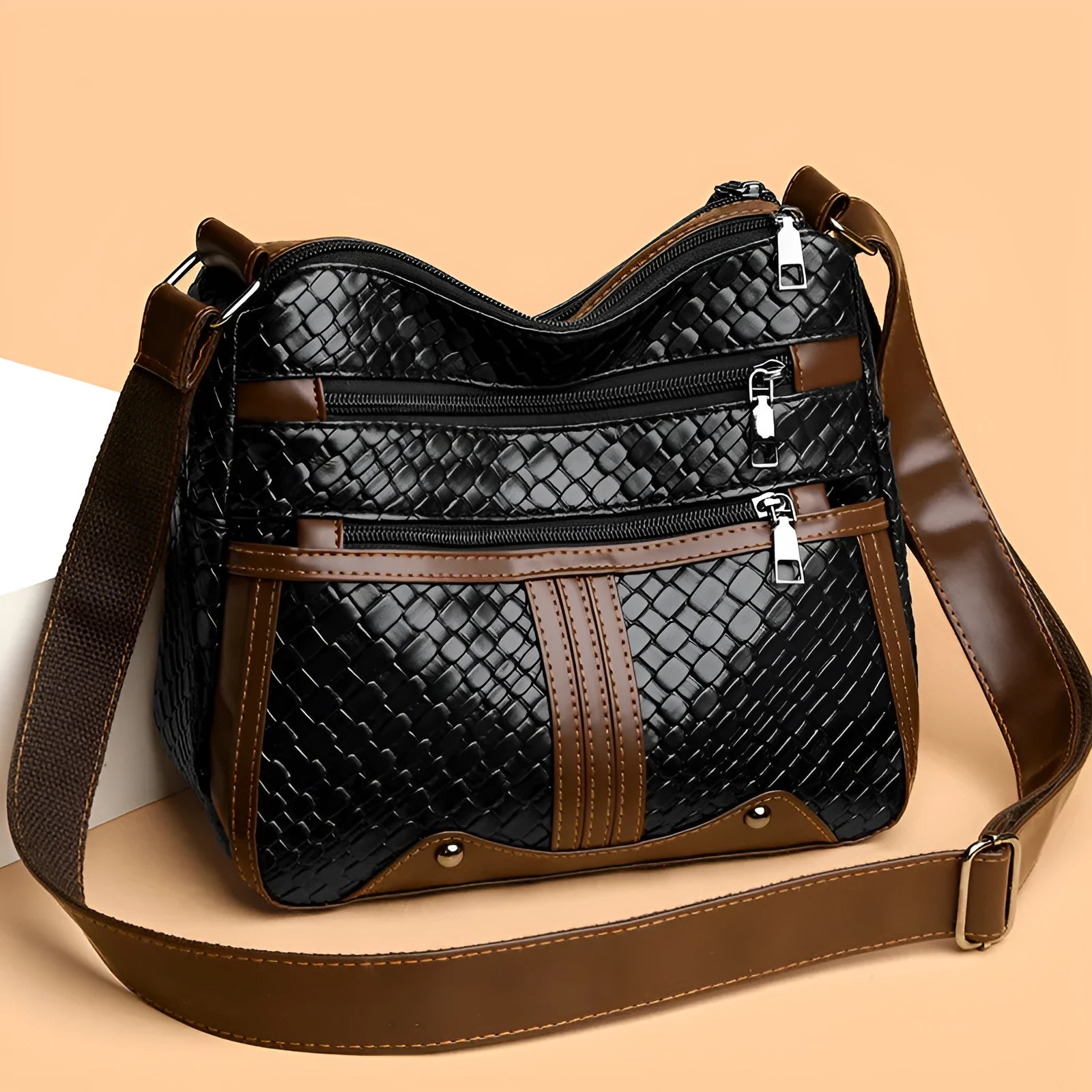 Woven PU messenger bag with horizontal square shape showing multiple compartments and internal zipper change pocket