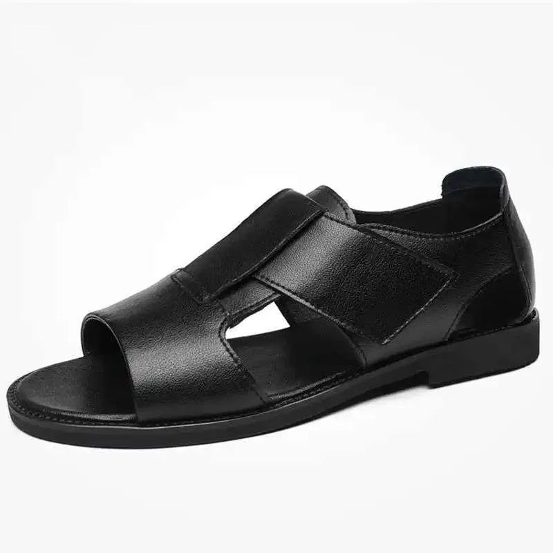 Men's black leather sandals with open-toe design and non-slip rubber soles on a beach background