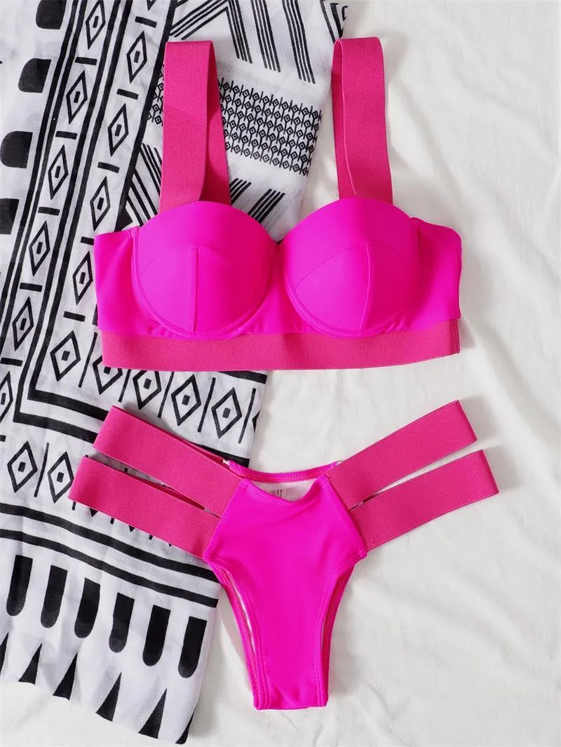 Women's contrast colour bikini swimsuit with steel push-up bracket, shown in rose red.