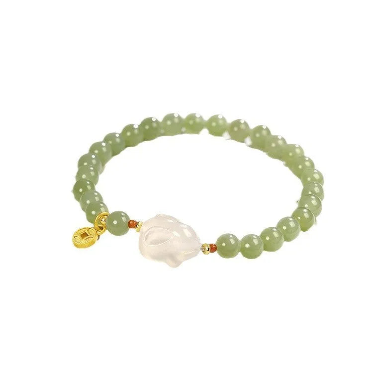 Handmade Hetian jade rabbit bracelet for women in glass, showing rabbit charm designs.