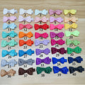 Assortment of pastel-coloured fully lined hair clips and bows for babies and toddlers.