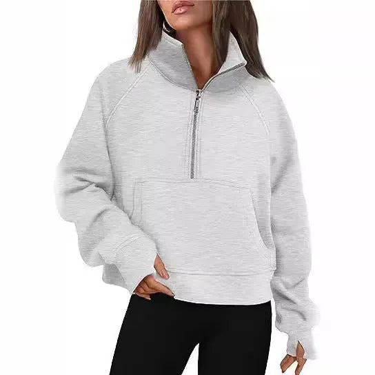Women's loose fit lapel sweater with fleece lining and long raglan sleeves in a solid colour.