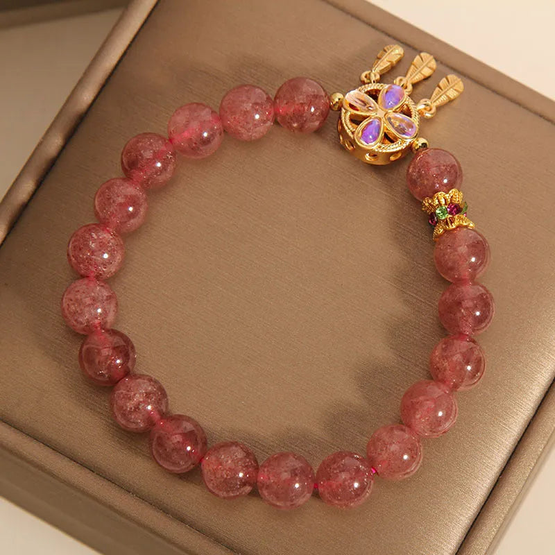 Strawberry quartz women's bracelet with four leaf clover dream catcher design and ball pendant charm