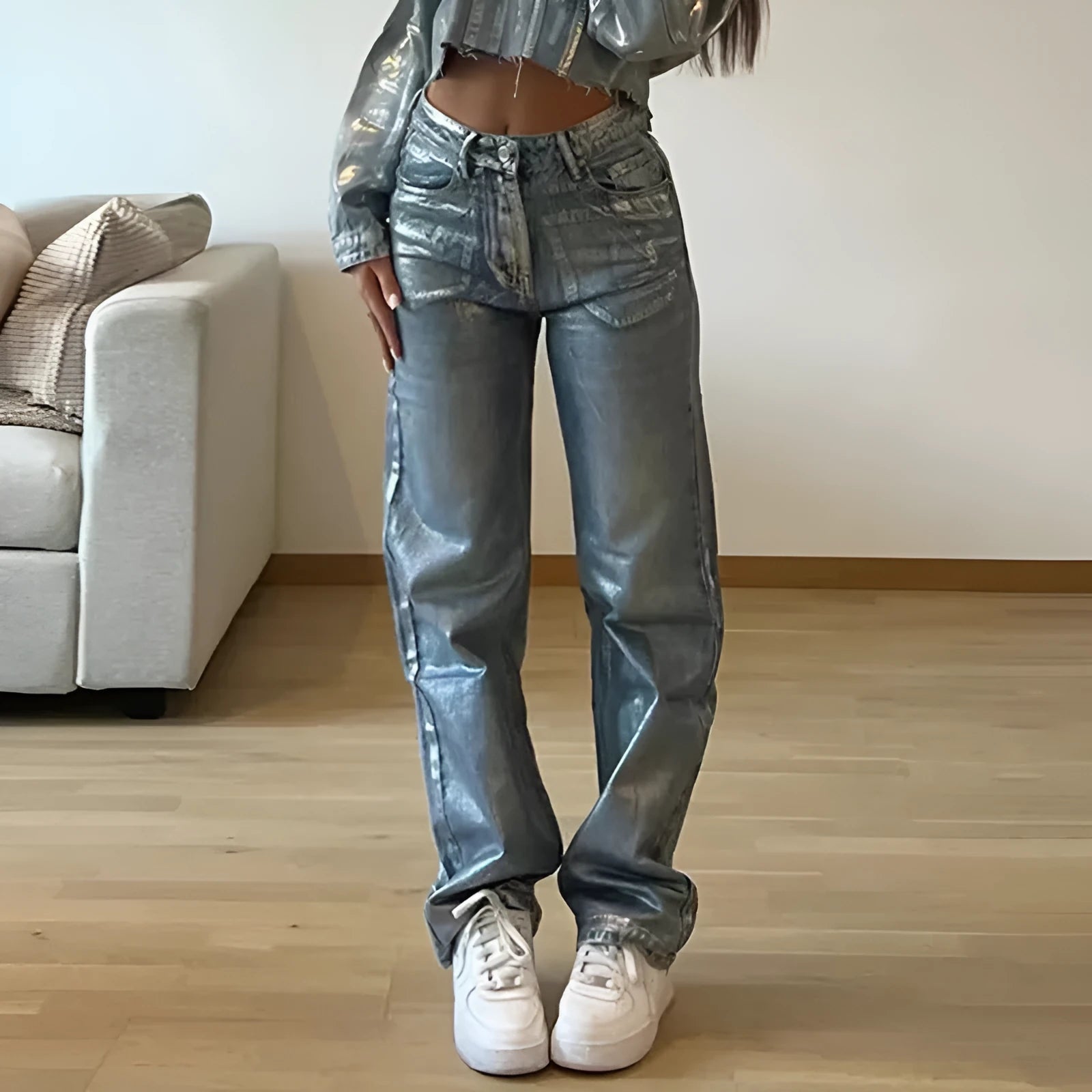 High waisted straight leg blue denim jeans with contrast stitching on a model.