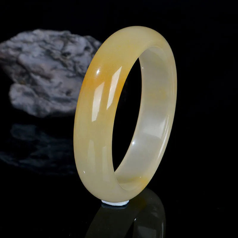 Natural light jade bracelet for women in Chinese style with polished finish on wrist