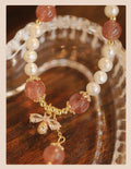 INS style women's bracelet with strawberry quartz stringed pearls and a central bow detail