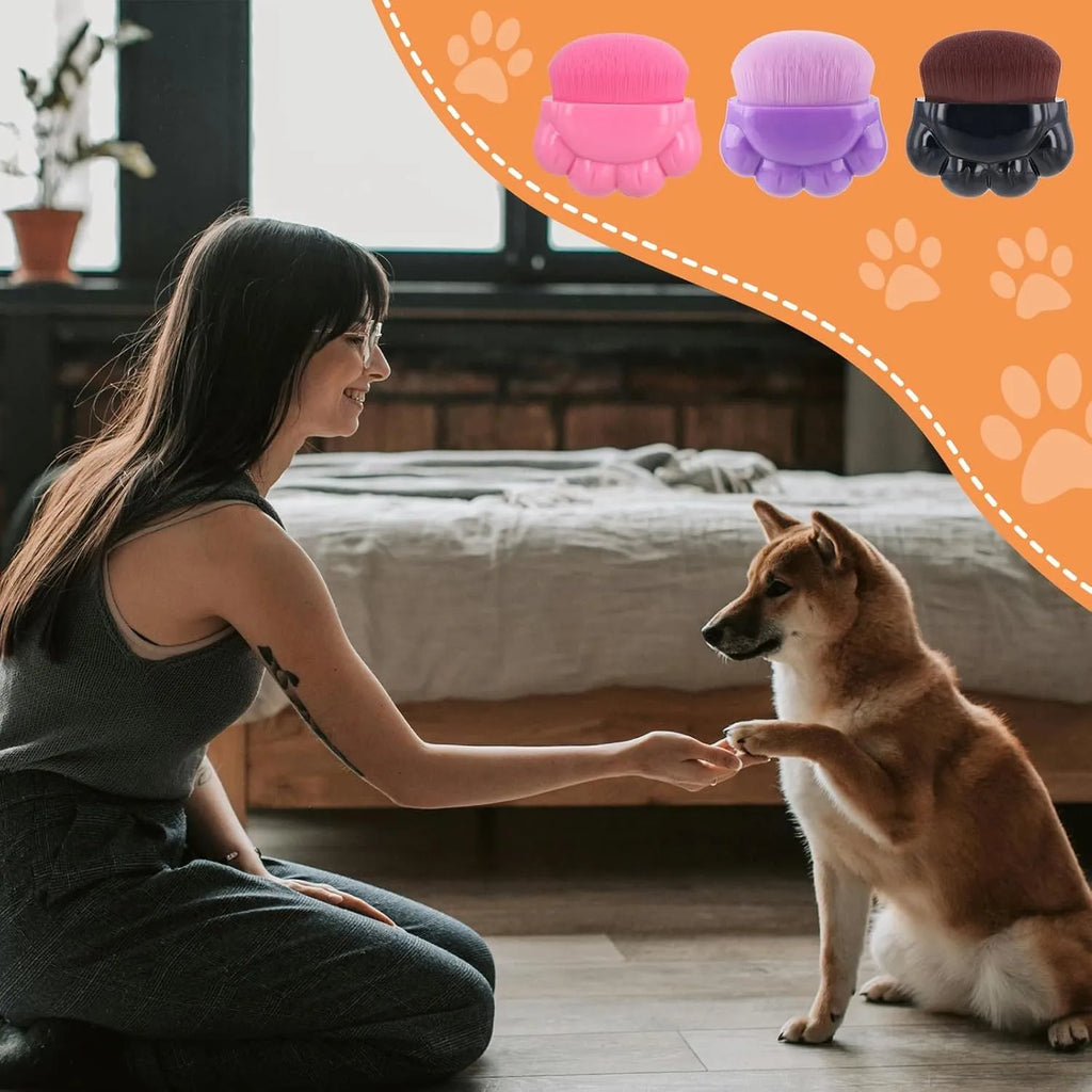 Set of three paw-shaped pet balm brushes with individual plastic storage boxes.