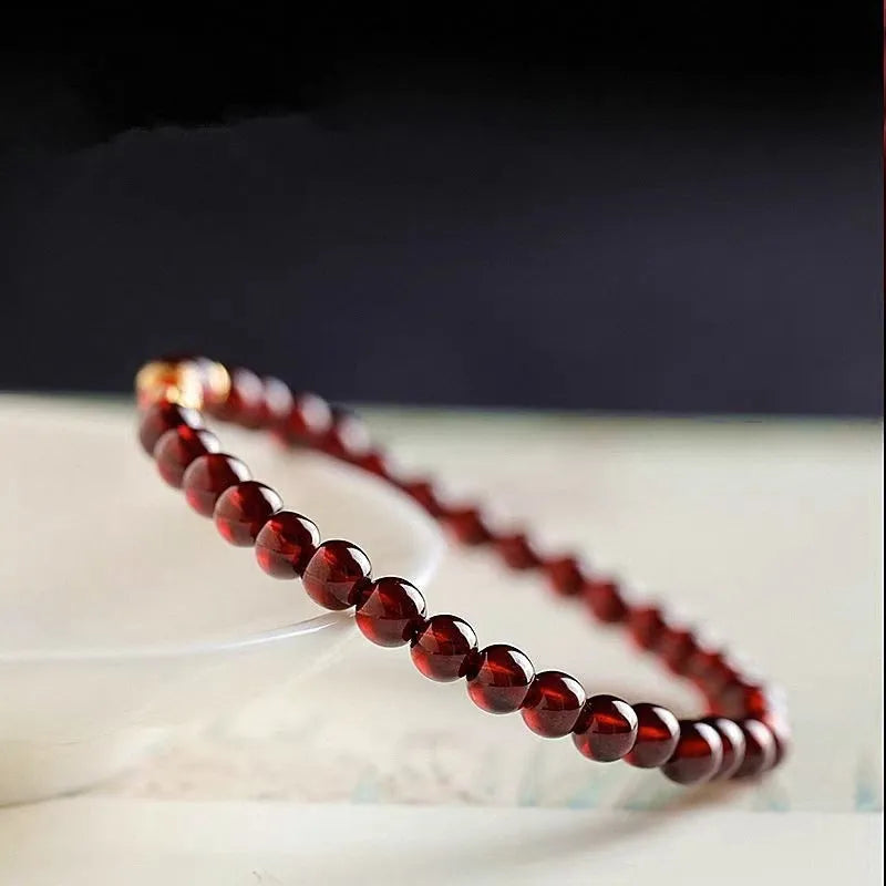 Women's wine red bracelet with garnet design in glass and coloured glaze