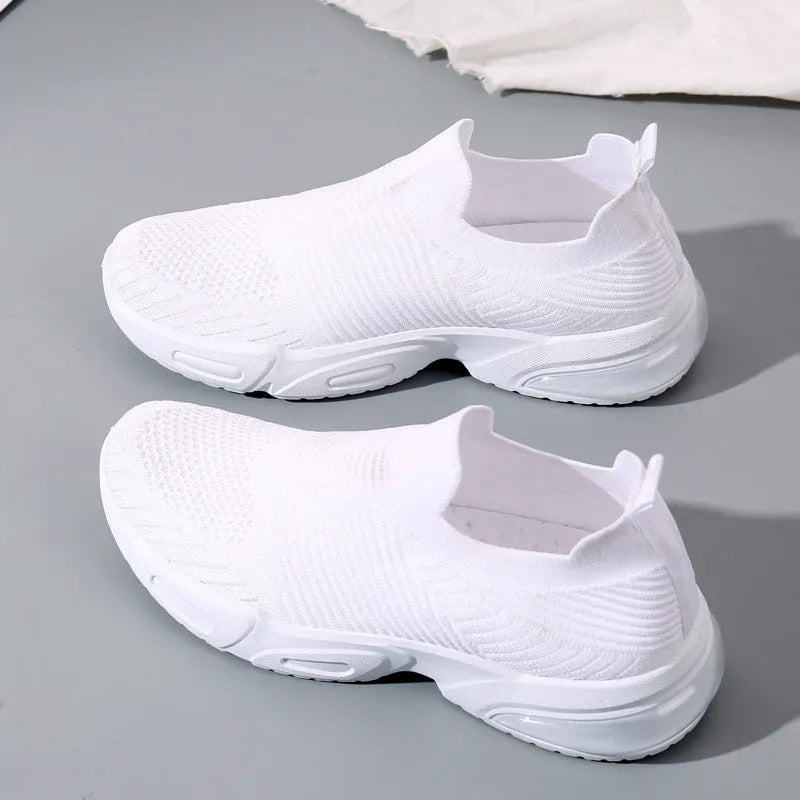 Slip-on sock shoes with mesh lining and PVC sole in black, white, pink, and khaki colours