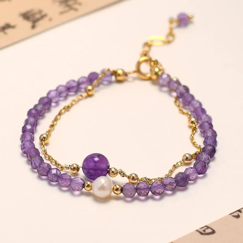 Amethyst crystal bracelet with diamond-shaped stones, adjustable chain, and Chinese-style clasp on wrist